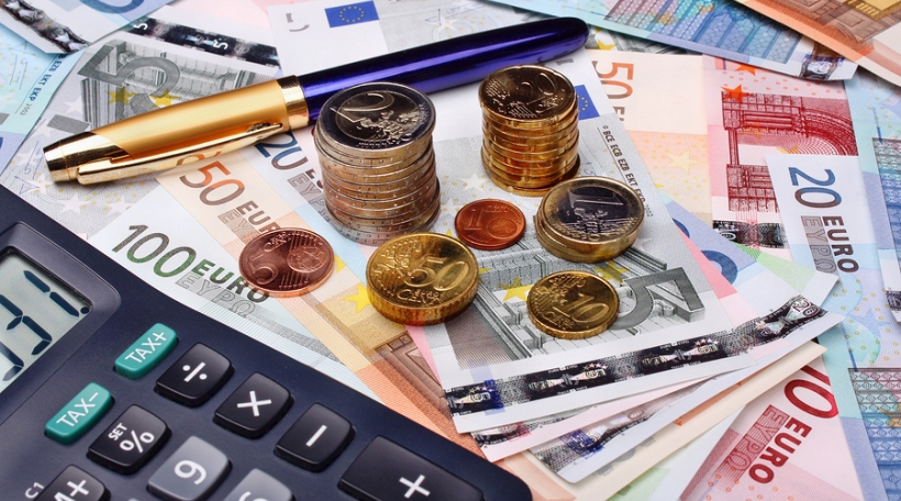 Euro money and calculator on money background Euro money and calculator on money background