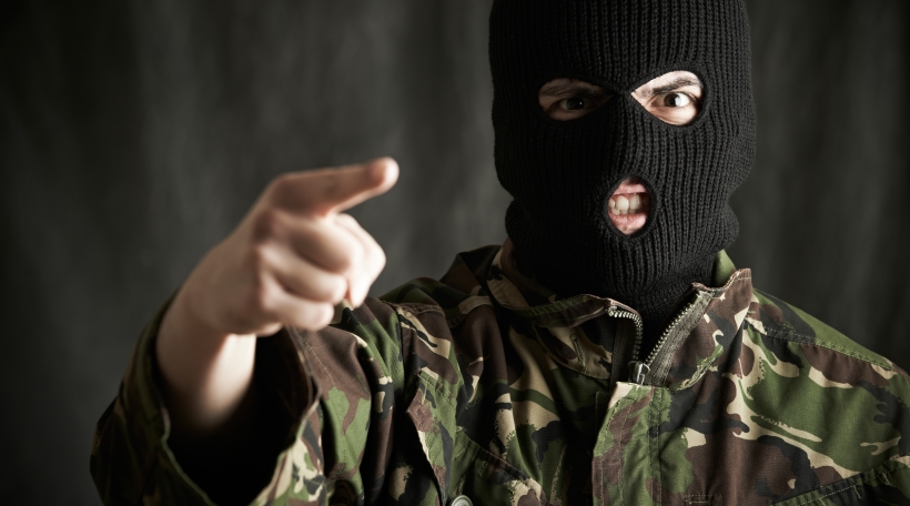 Portrait Of Threatening Terrorist Wearing Balaclava Addressing Camera