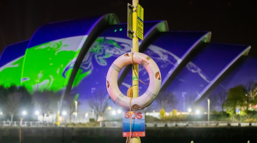A lifebelt hangs on the banks of the River Clyde in front of the UN Climate Change Conference COP26, which is taking place at the Scottish Exhibition and Conference Centre in Glasgow. For two weeks, some 200 countries are wrestling in Glasgow over how the